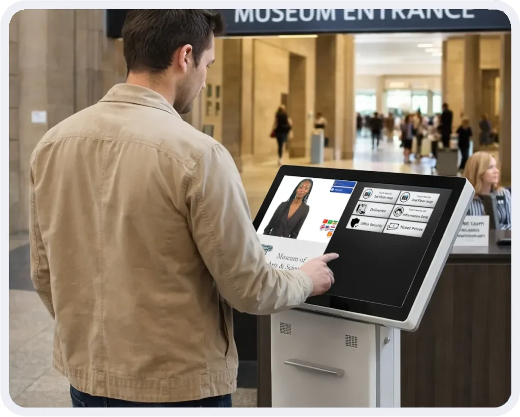 Visitor uses a museum kiosk to access services.