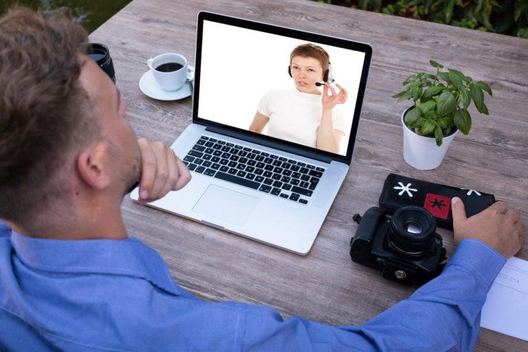 man watching a virtual receptionist